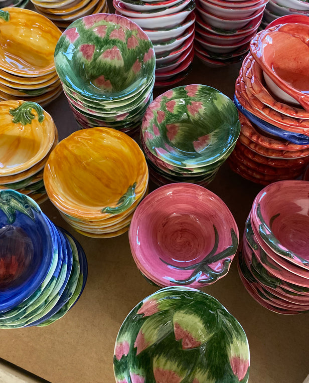 stacks of ceramic colorful dishes 