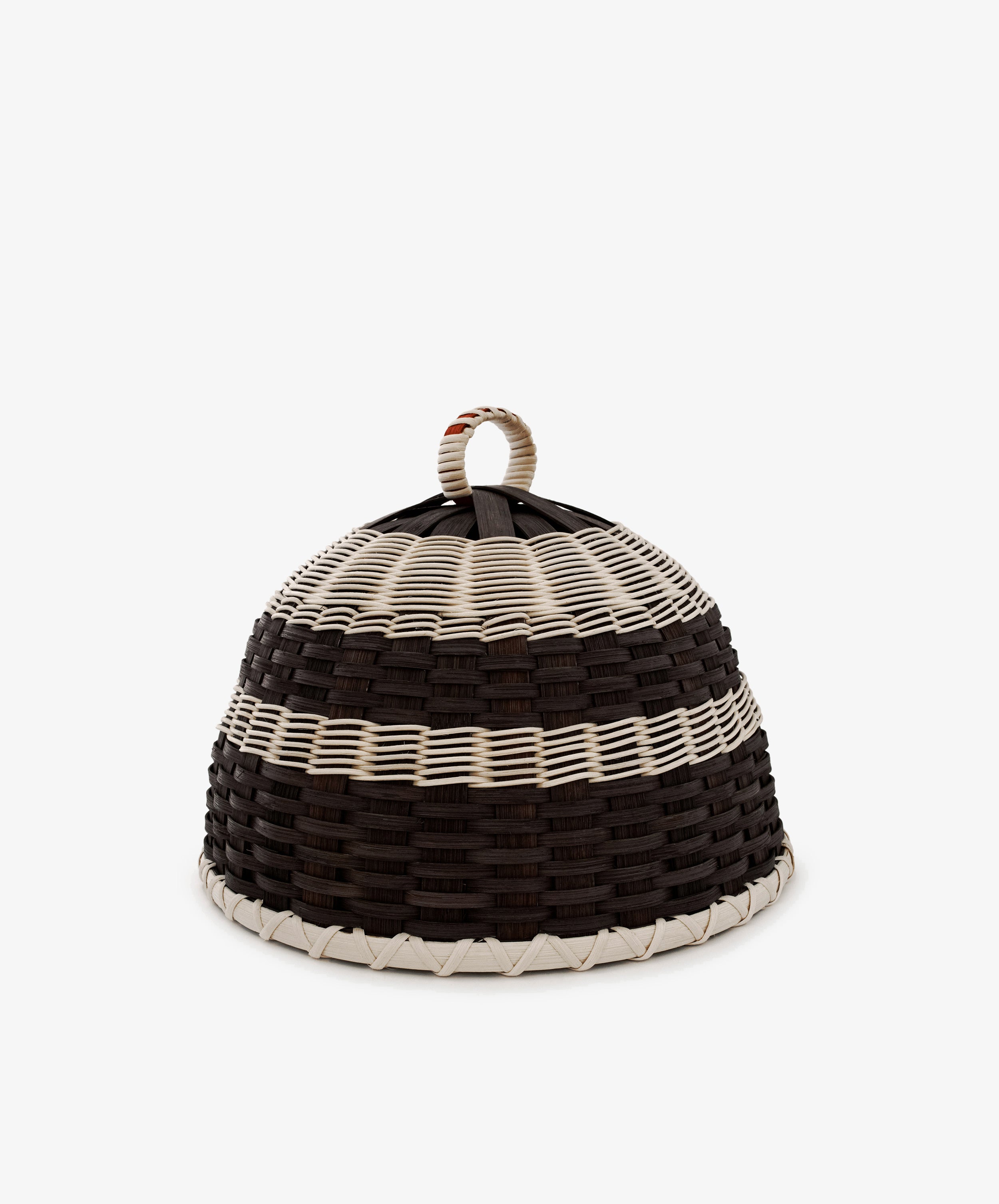 Introducing the Folk Fleur Cloche: a handwoven, dome-shaped basket distinguished by alternating black and white horizontal stripes and topped with a convenient loop handle. Designed for both style and practicality, it serves perfectly as a cheese cover for outdoor entertaining. Set against a plain white background, the Folk Fleur Cloche seamlessly combines modern appeal with thoughtful functionality.