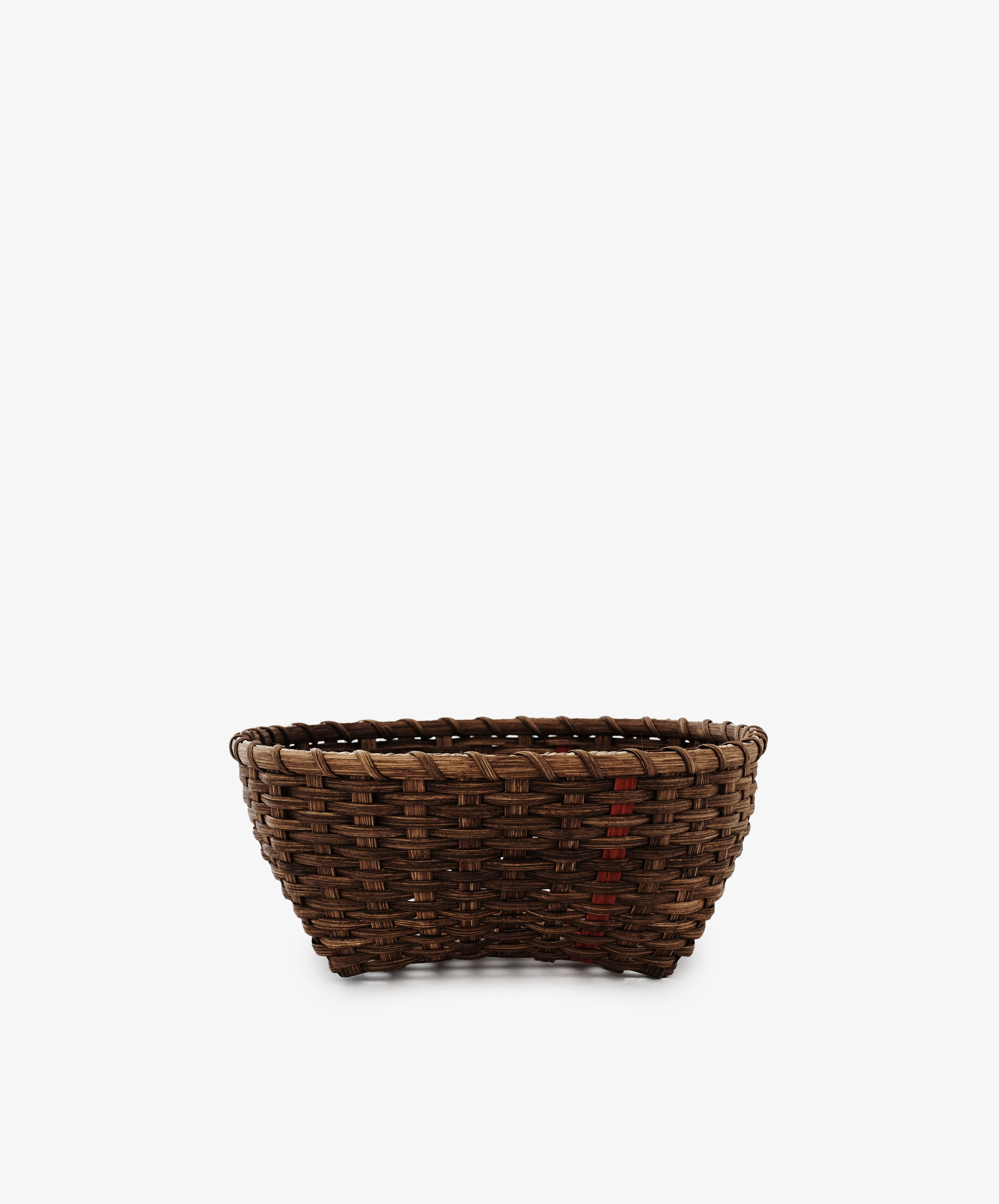 The Medium Love Basket is a brown woven rattan basket with a slightly flared top, shown on a white background—perfect as decorative kitchen storage.