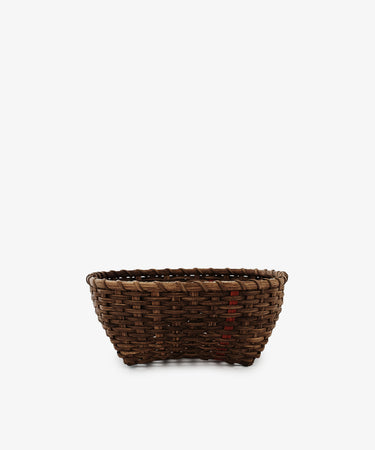 The Medium Love Basket is a brown woven rattan basket with a slightly flared top, shown on a white background—perfect as decorative kitchen storage.