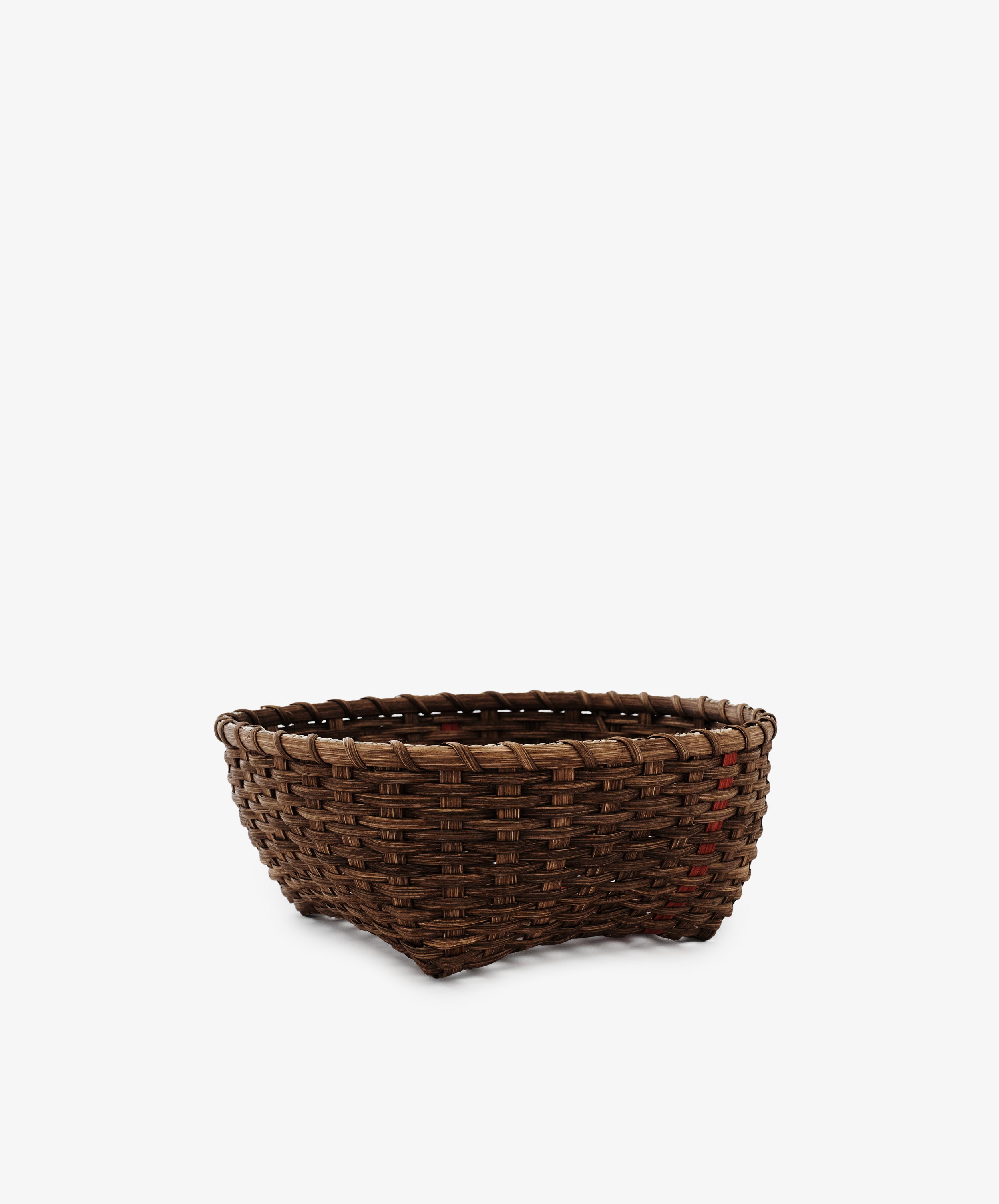 A Medium Love Basket, featuring a handwoven rectangular design in dark brown wicker, sits empty against a plain white background.