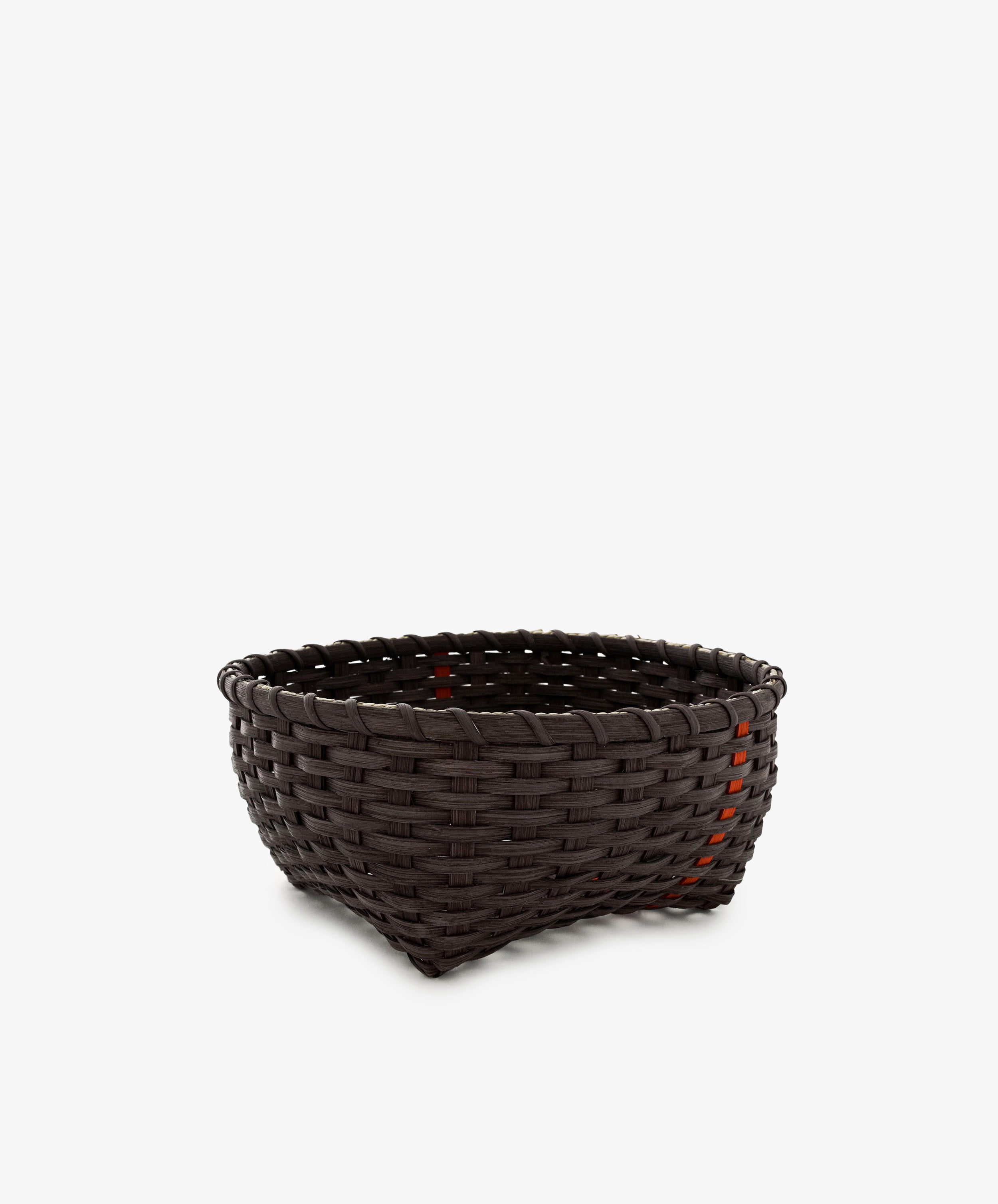 A medium-sized, empty, dark brown handwoven Love Basket with a slightly tapered shape, placed against a plain white background.