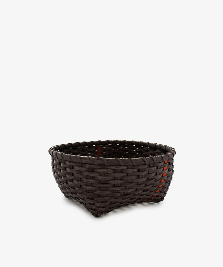 A medium-sized, empty, dark brown handwoven Love Basket with a slightly tapered shape, placed against a plain white background.