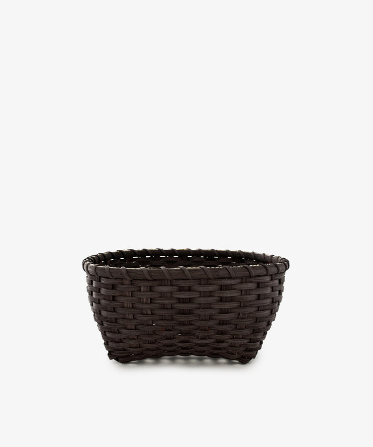 A medium-sized, dark brown handwoven Love Basket is placed against a plain white background.