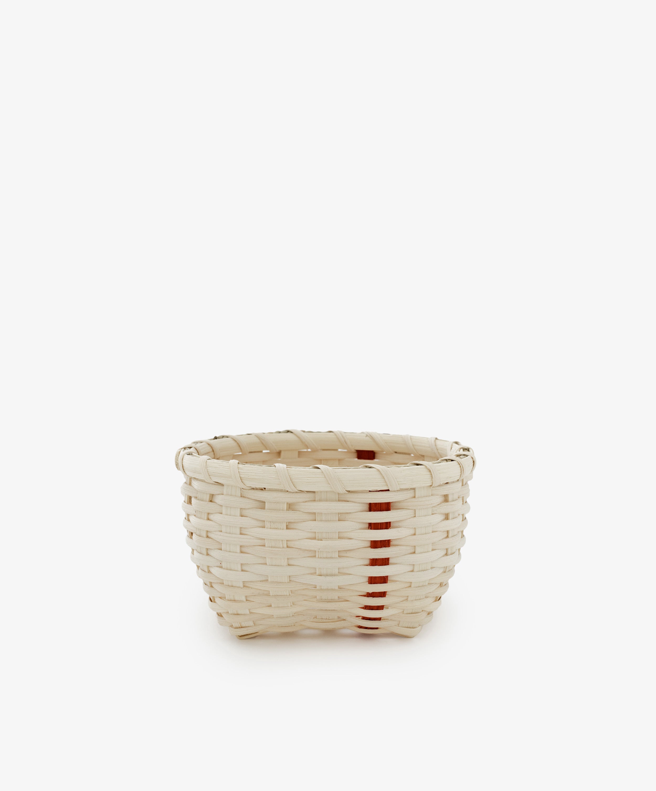 The Little Love Basket is a small handwoven basket in natural beige with a single vertical red stripe, shown on a plain white background.