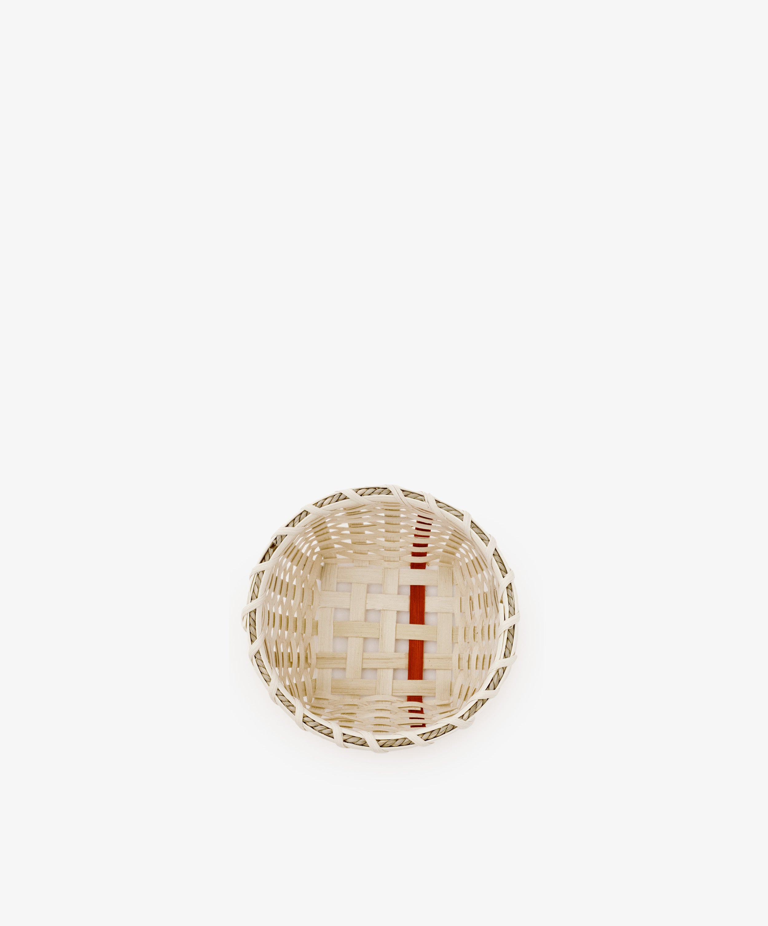 The Little Love Basket, a small, round handwoven piece featuring natural and red accents, is centered on a plain white background.