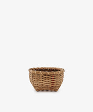 The Little Love Basket is a small, round handwoven basket with a simple design, shown against a plain white background.