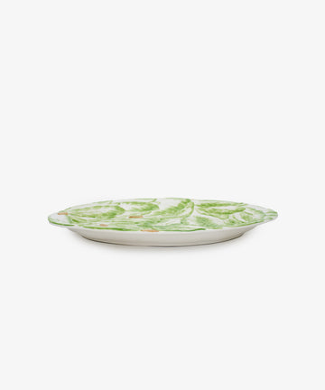 Radicchio Oval Serving Platter. Green painted lettuce earthenware plate, side view.