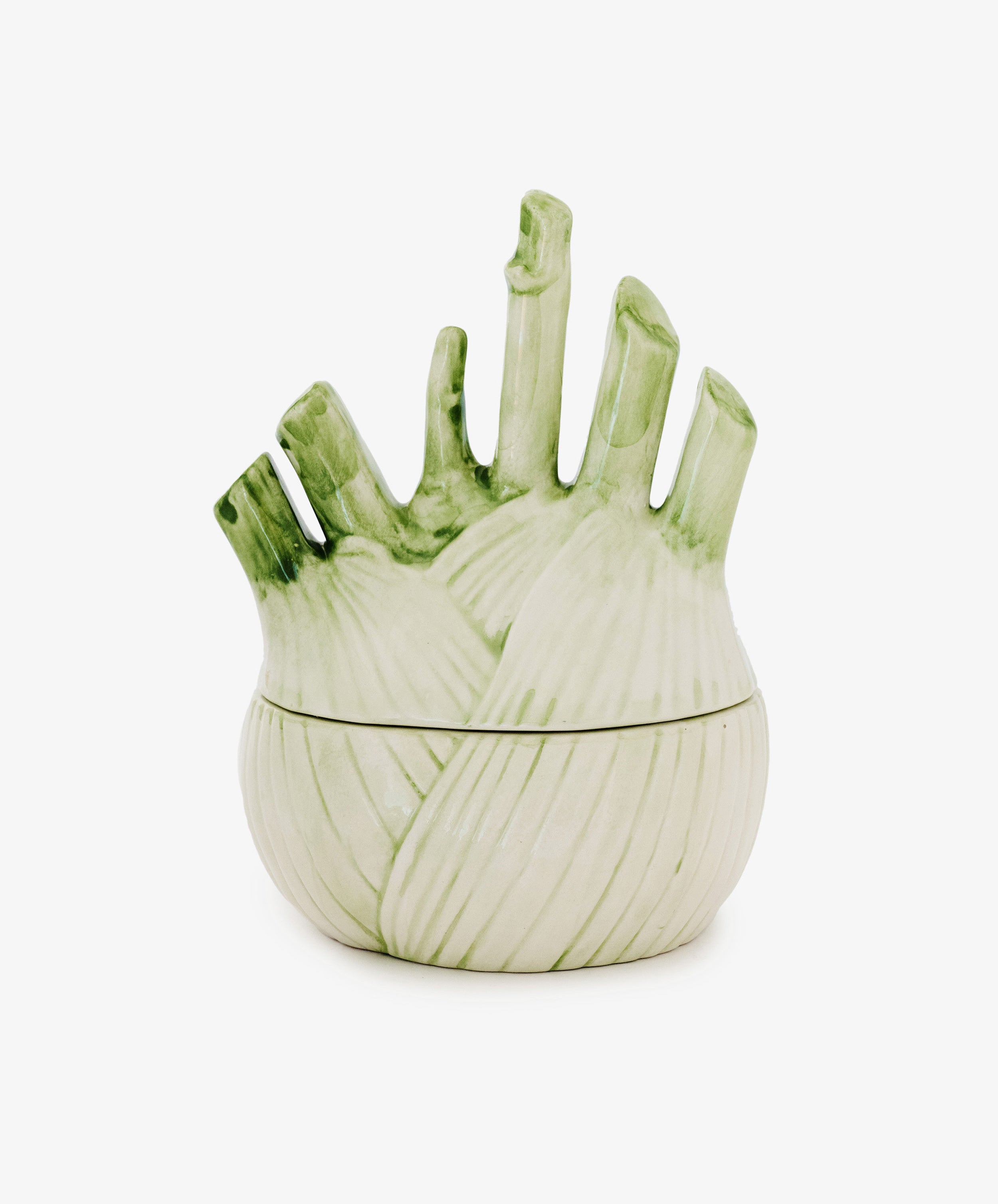 The Fennel Sauce Bowl is a ceramic serving piece shaped like a fennel bulb, featuring a matching lid and light green accents, inspired by skilled Italian ceramicists.