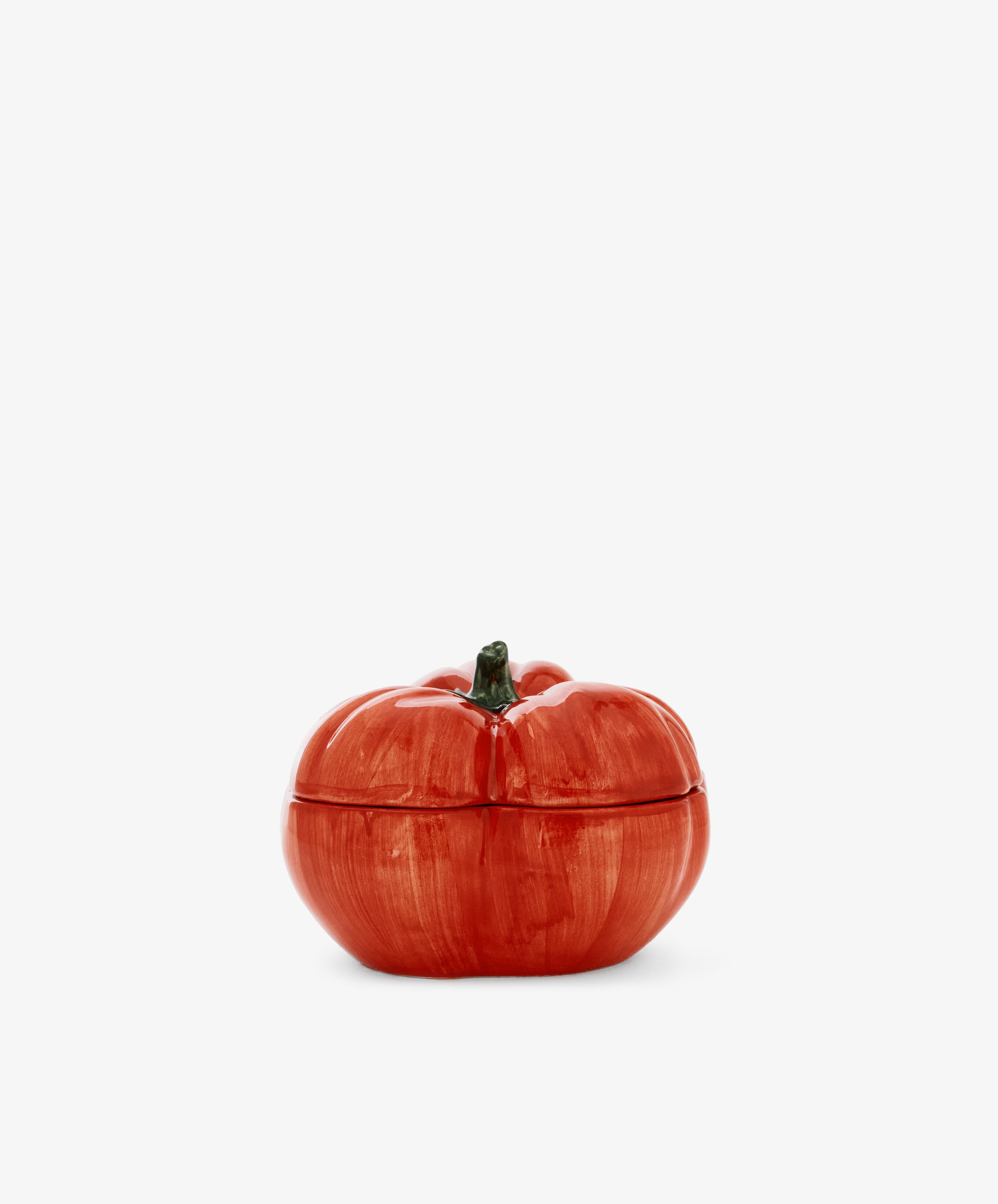 Introducing the Tomato Sauce Bowl—a delightful ceramic piece shaped and painted to resemble a vibrant heirloom tomato with a green stem. This trompe l’oeil-inspired bowl brings whimsical charm and country house kitchen style to any setting with its playful design and crisp white background.