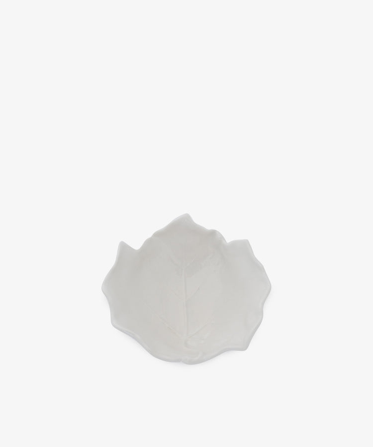 The Leaf Bowl is a small, white ceramic bowl shaped like a leaf, displayed on a plain white background.
