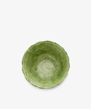 Artichoke bowl, overhead view, in green painted earthenware.