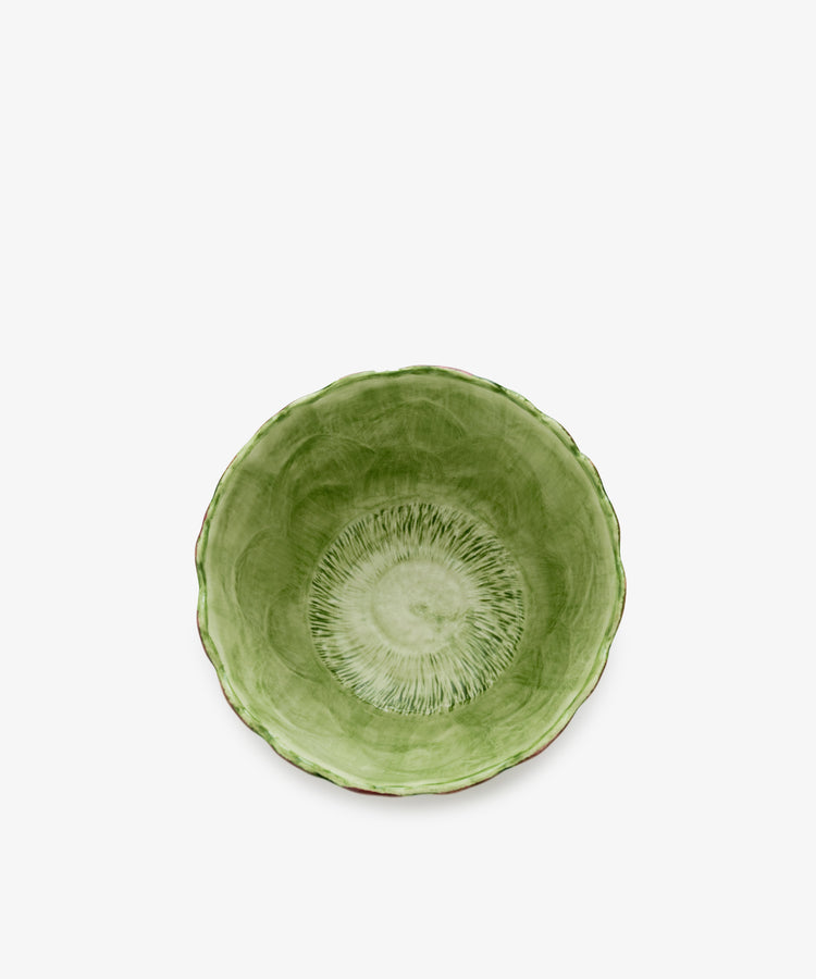 Artichoke bowl, overhead view, in green painted earthenware.