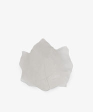 The Leaf Serving Bowl is a white ceramic bowl shaped like a leaf, featuring visible vein details that evoke an Italian countryside table, displayed against a plain white background.