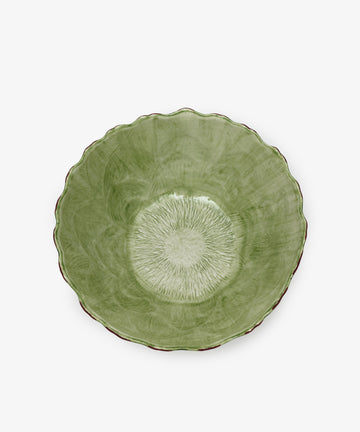 The Artichoke Serving Bowl is green ceramic with a scalloped edge and textured radial pattern inside, hand-finished and shown from above on a white background.