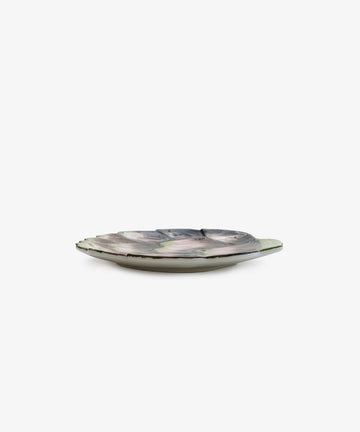 The Artichoke Small Plate, a shallow round ceramic dish with a wavy petal rim and glossy multicolored finish inspired by Italian clay plates, is shown on a plain white background.