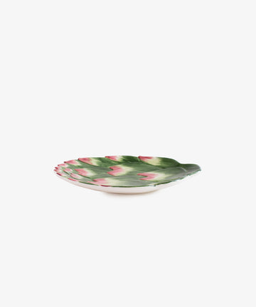 Artichoke small plate. Green and purple hand-painted earthenware plate resembling artichoke petals, side view.