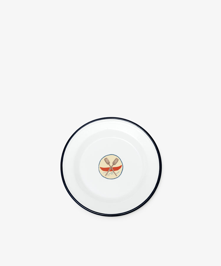 The Camp Plates, Set of 4, feature white enamel with a dark rim and a central design of crossed wooden spoons above an orange banner—evoking vintage scout badges and perfect for kids' tableware.