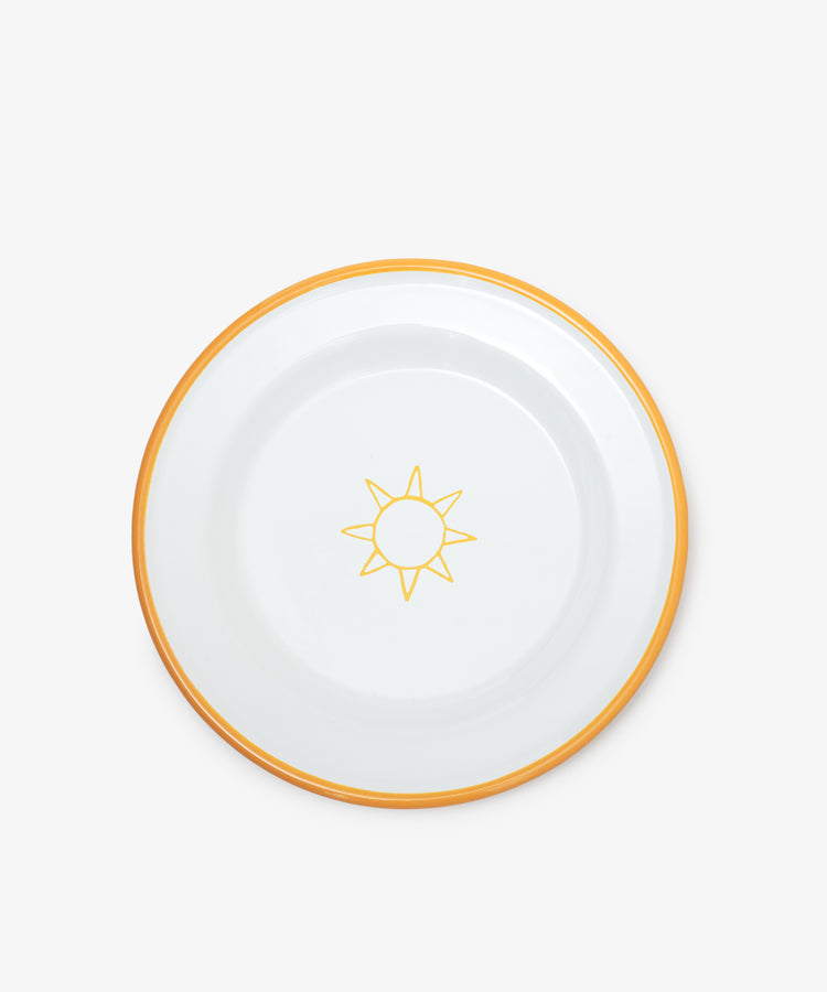 The Il Sole Enamel Plate, Set of 2 features white plates with a central yellow sun motif and a yellow rim—ideal for adding a cheerful touch to your summer tableware.