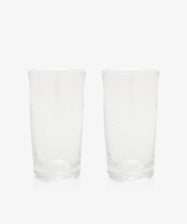 The Lauren Juice Glass, Set of 2, features two tall glass tumblers with a subtle textured pattern, displayed side by side on a plain white background.