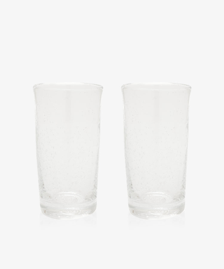 The Lauren Juice Glass, Set of 2, features two tall glass tumblers with a subtle textured pattern, displayed side by side on a plain white background.