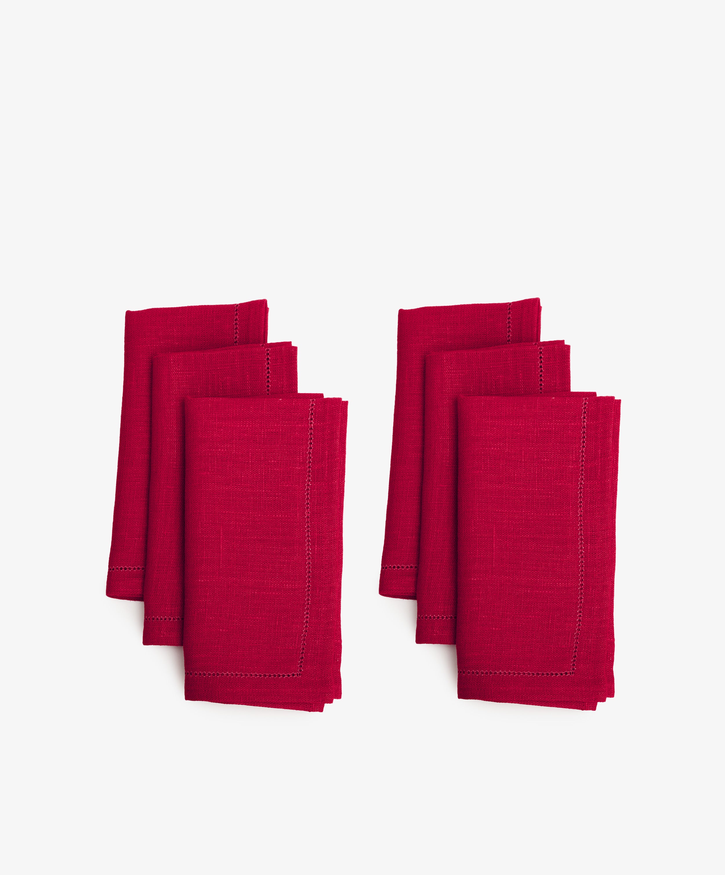 Magnetic Color Field Napkin. Two rows of three folded rectangular napkins in red linen with stitching.