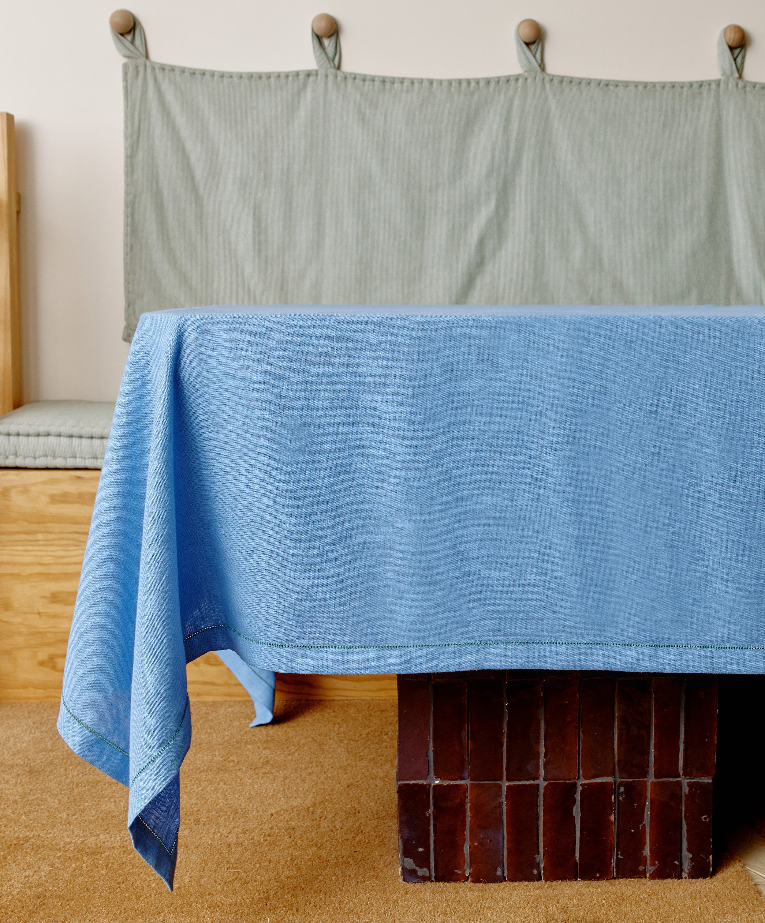 Magnetic Color Field tablecloth on blue side, draped over a table.