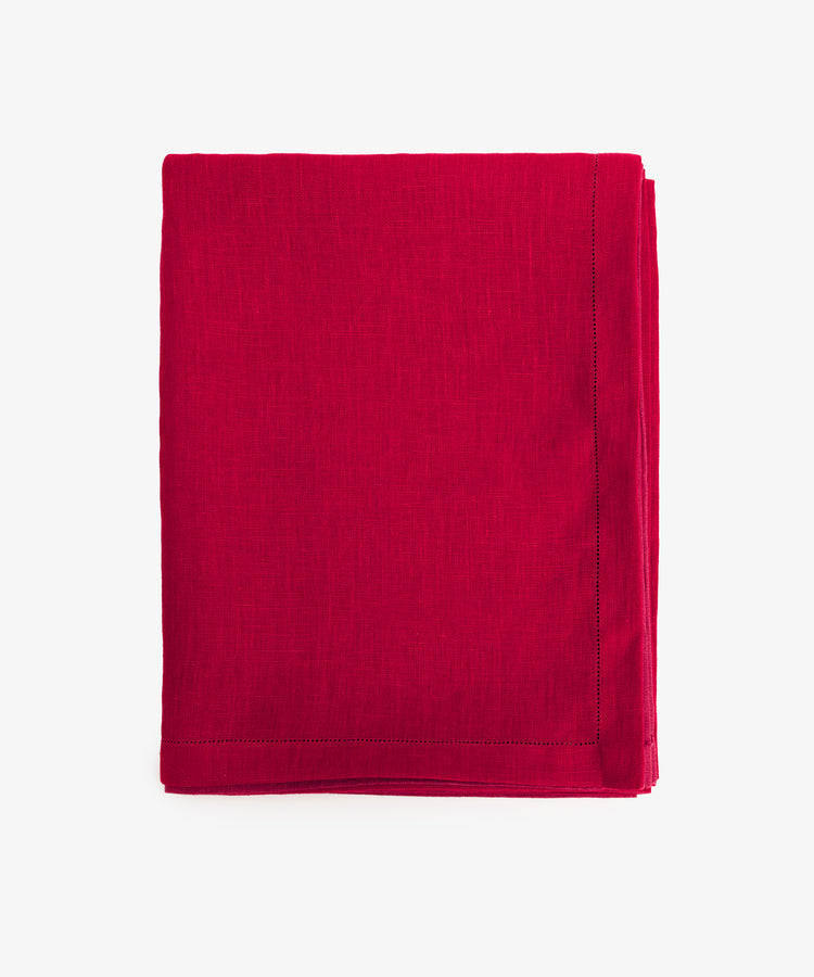 Magnetic Color Field Tablecloth. Folded red linen cloth with stitching