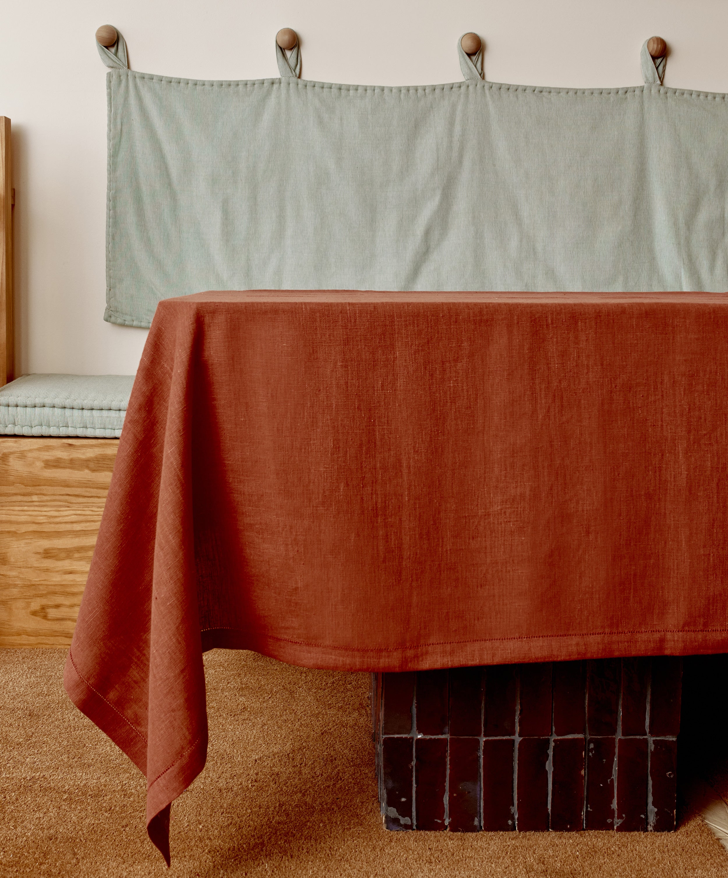 Magnetic Color Field tablecloth on terracotta side, draped over a table.