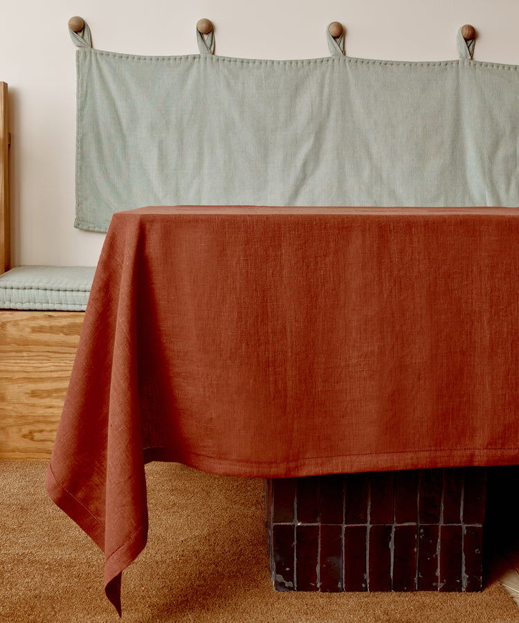 Magnetic Color Field tablecloth on terracotta side, draped over a table.