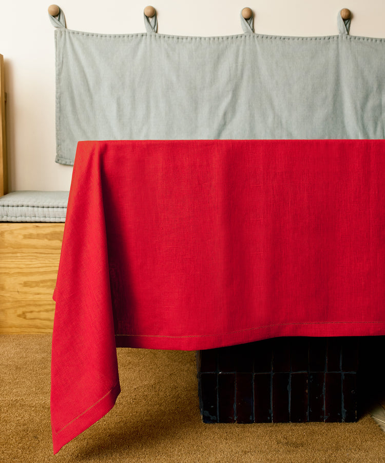 Magnetic Color Field tablecloth on red side, draped over a table.