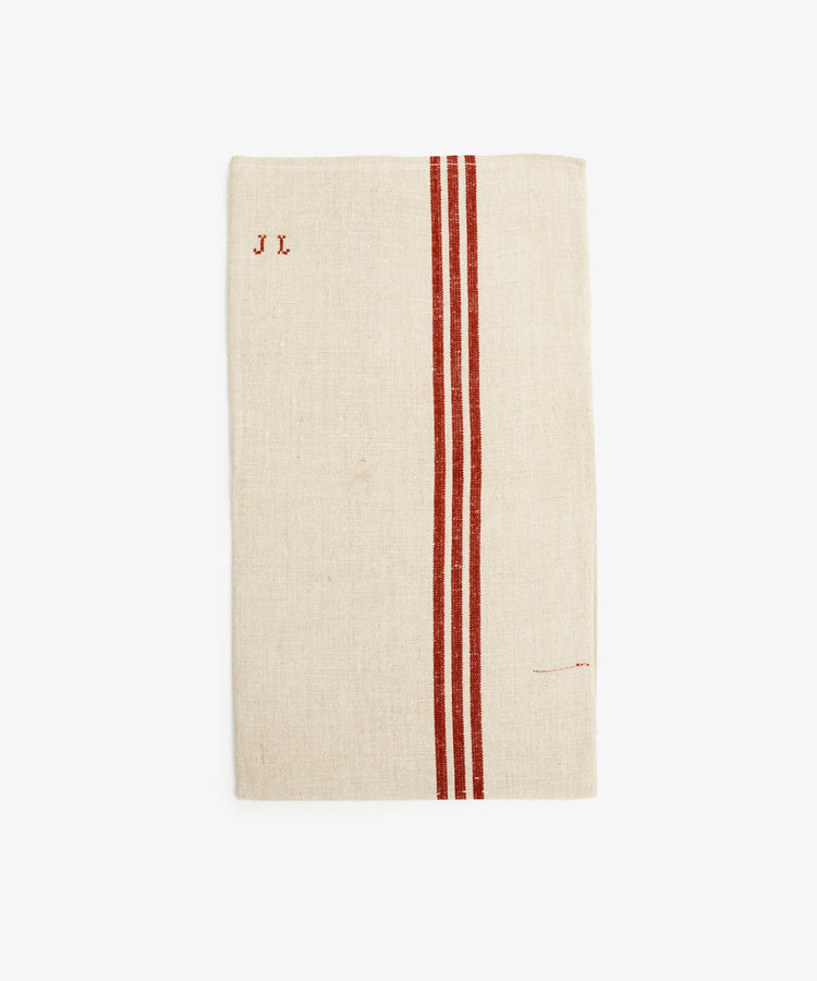 French Vintage Striped Tea Towel. Rectangular folded white linen napkin with two rust-colored stripes and 