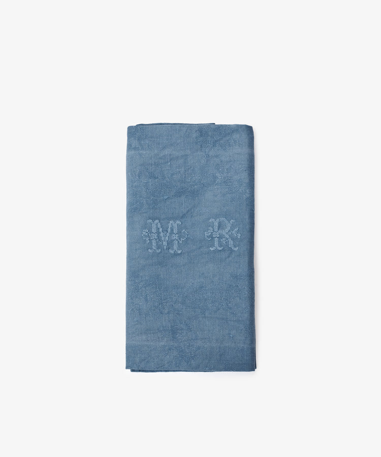 A set of 6 vintage blue damask linen napkins with embroidered M and R initials at the center, shown folded on a plain white background.