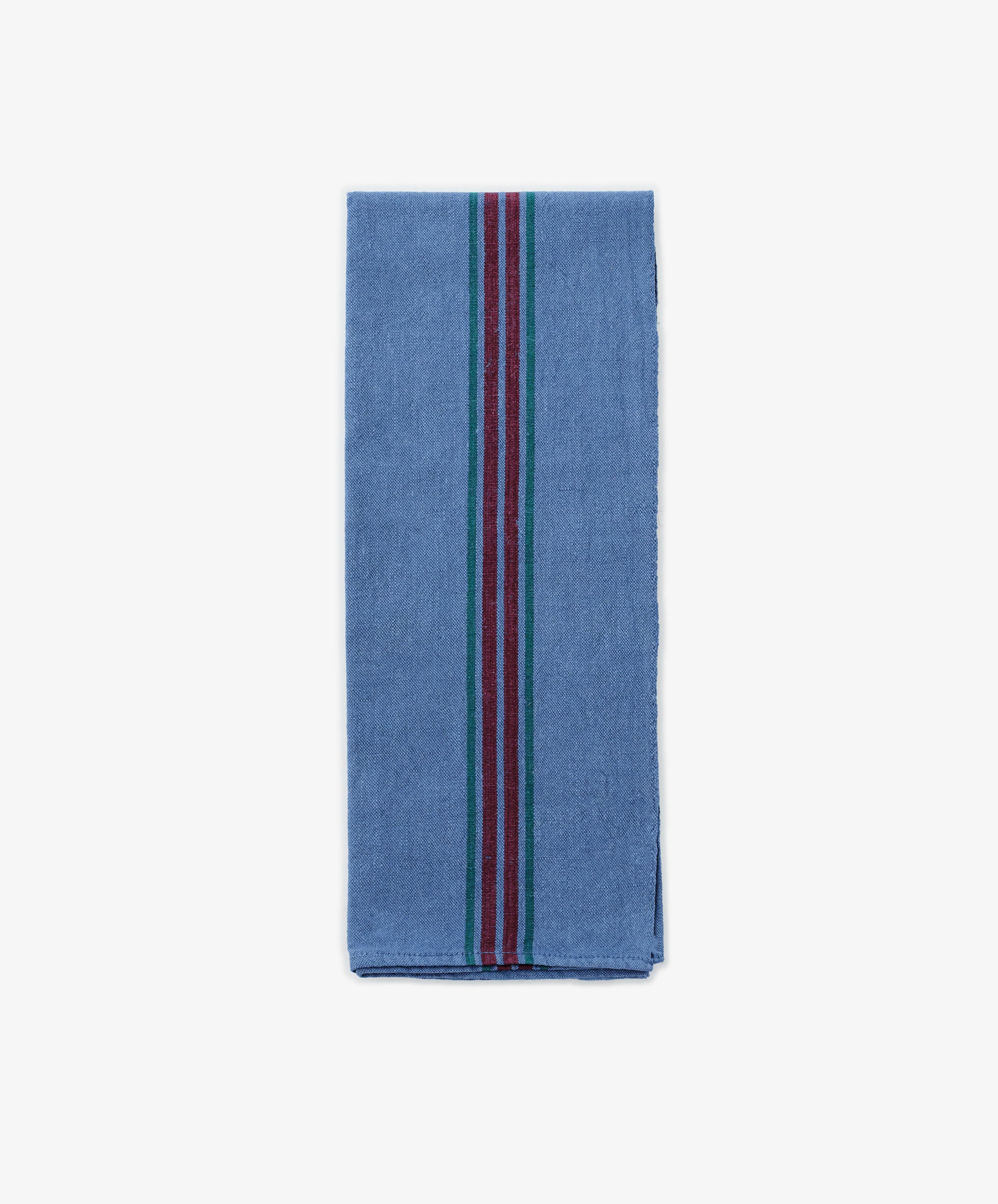 A French Vintage Tea Towel, folded and blue with vertical red, green, and blue center stripes reminiscent of classic linen tea towels, is displayed on a plain white background.