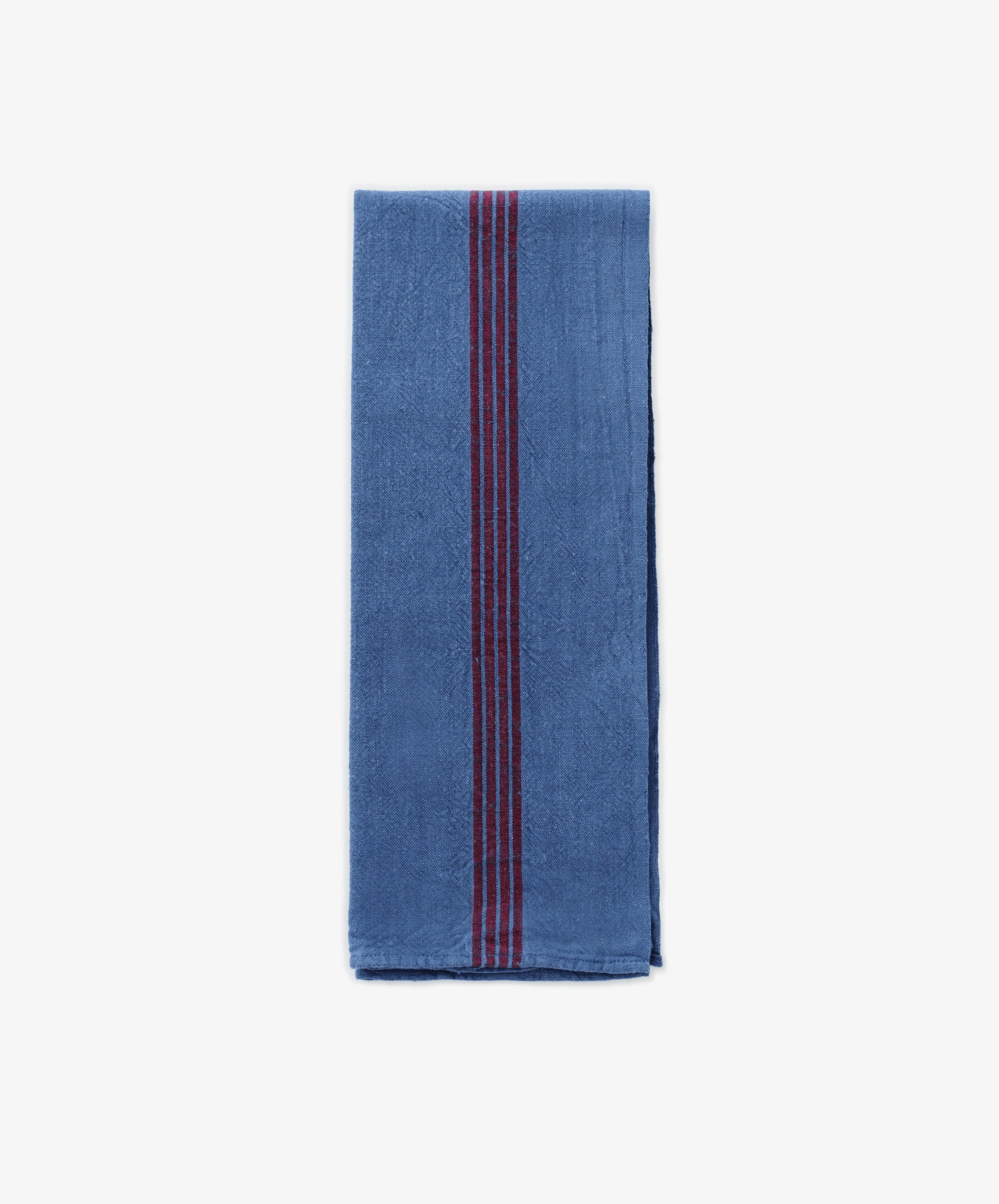 The French Vintage Tea Towel features neat blue fabric with bold red vertical center stripes, evoking classic Provence linen. Set on a plain white background, it adds an elegant and timeless accent to any kitchen decor.