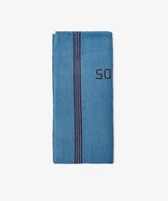 The French Vintage Tea Towel is a folded blue cloth with two vertical dark stripes and the number 50 stitched on the right, inspired by classic Provence linen—ideal for bringing charm to your kitchen.