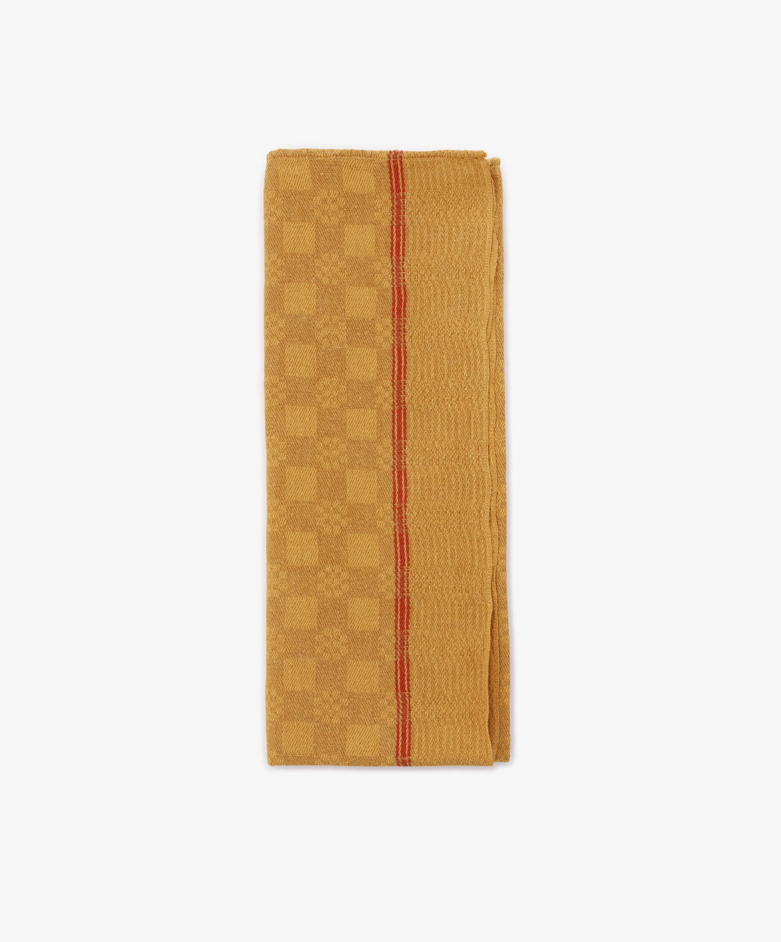 The French Vintage Tea Towel, in mustard yellow with a subtle checkered pattern and single red stripe, evokes classic Provence charm—perfect for your kitchen. The folded linen is set against a white background.