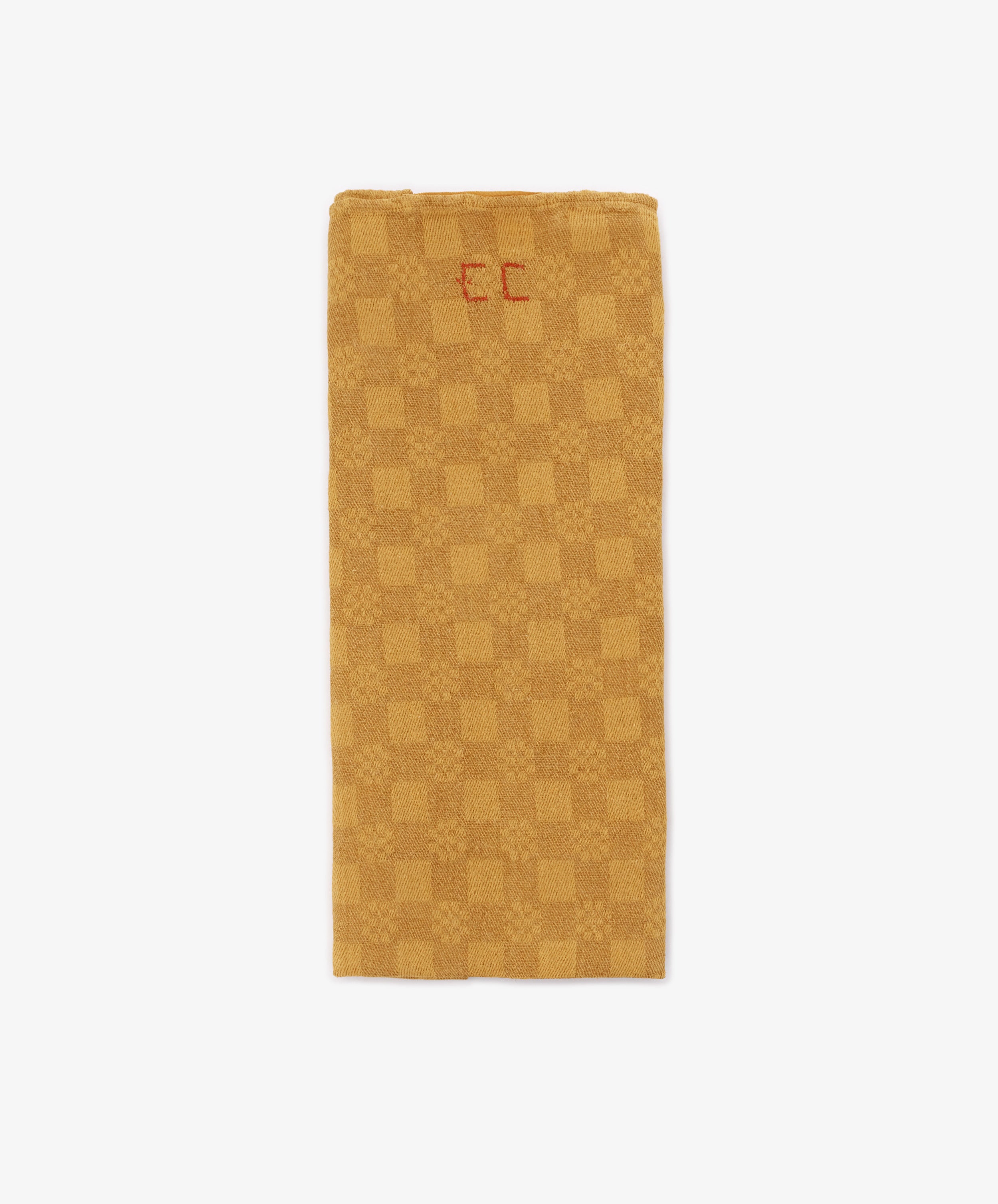 A French Vintage Tea Towel in a rectangular gold and beige checkered pattern features 