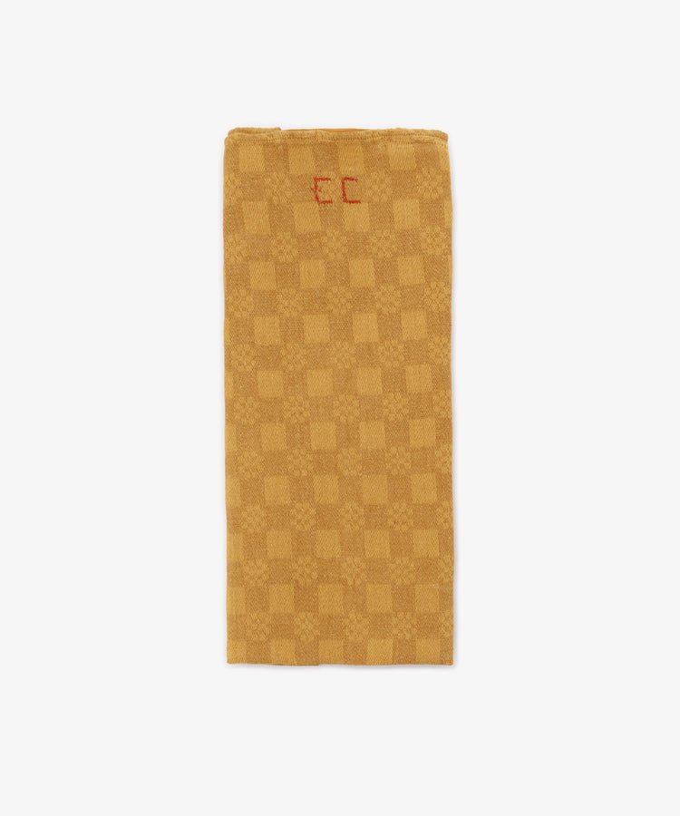 A French Vintage Tea Towel in a rectangular gold and beige checkered pattern features 