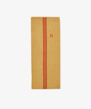 The French Vintage Tea Towel is a rectangular yellow cloth with two vertical red stripes and a small red embroidered 