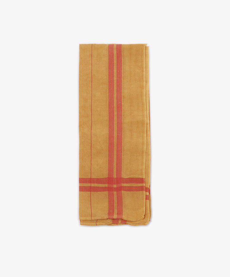 The French Vintage Tea Towel, a folded yellow cloth napkin with red stripes inspired by Provence linen, is displayed against a white background—perfect for adding charm to your kitchen.
