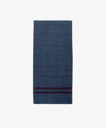 The French Vintage Tea Towel is a folded dark blue cloth napkin with a subtle checkered pattern and two maroon stripes near one edge, evoking Provence linen, displayed on a plain white background.