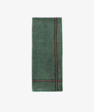 The French Vintage Tea Towel—a folded green cloth napkin with two parallel dark red edge stripes, reminiscent of classic linen tea towels—sits on a white background, adding charm and absorbency to any Provençal pantry.