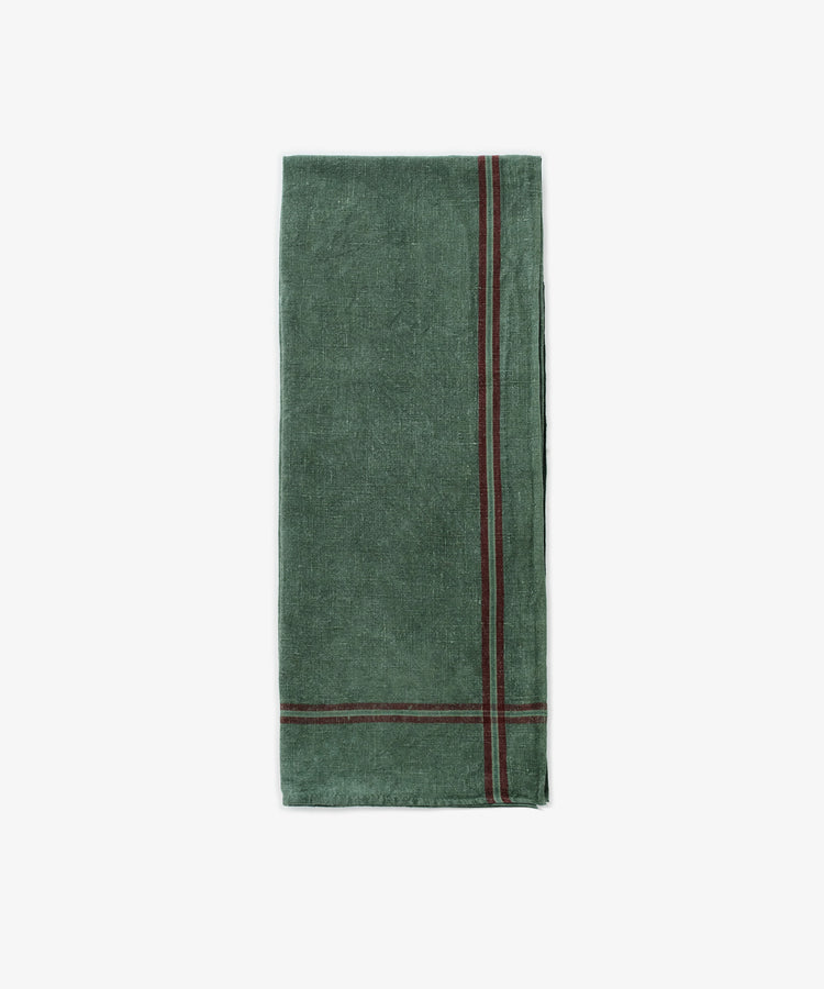 The French Vintage Tea Towel—a folded green cloth napkin with two parallel dark red edge stripes, reminiscent of classic linen tea towels—sits on a white background, adding charm and absorbency to any Provençal pantry.
