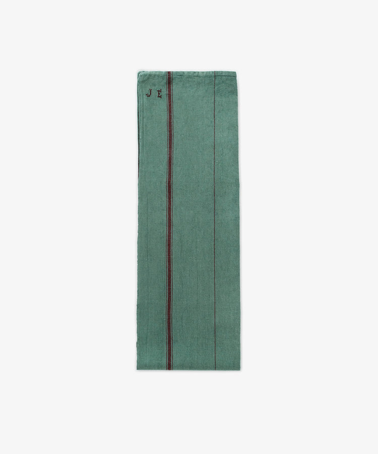 The French Vintage Tea Towel is a folded green linen with thin vertical stripes and 