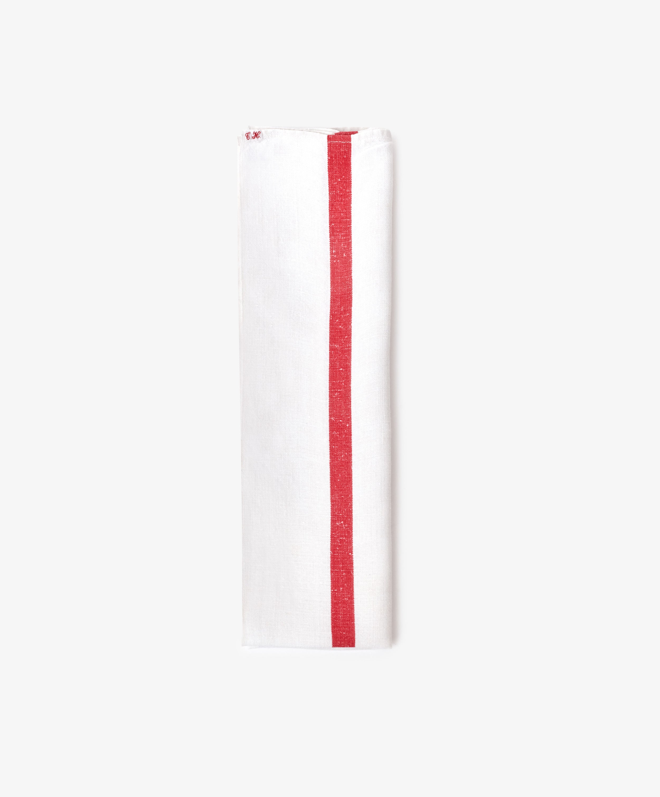 The French Vintage Tea Towel is a white cloth napkin folded lengthwise, featuring a single red vertical stripe near one edge, evoking classic vintage linen style and displayed against a plain light background.