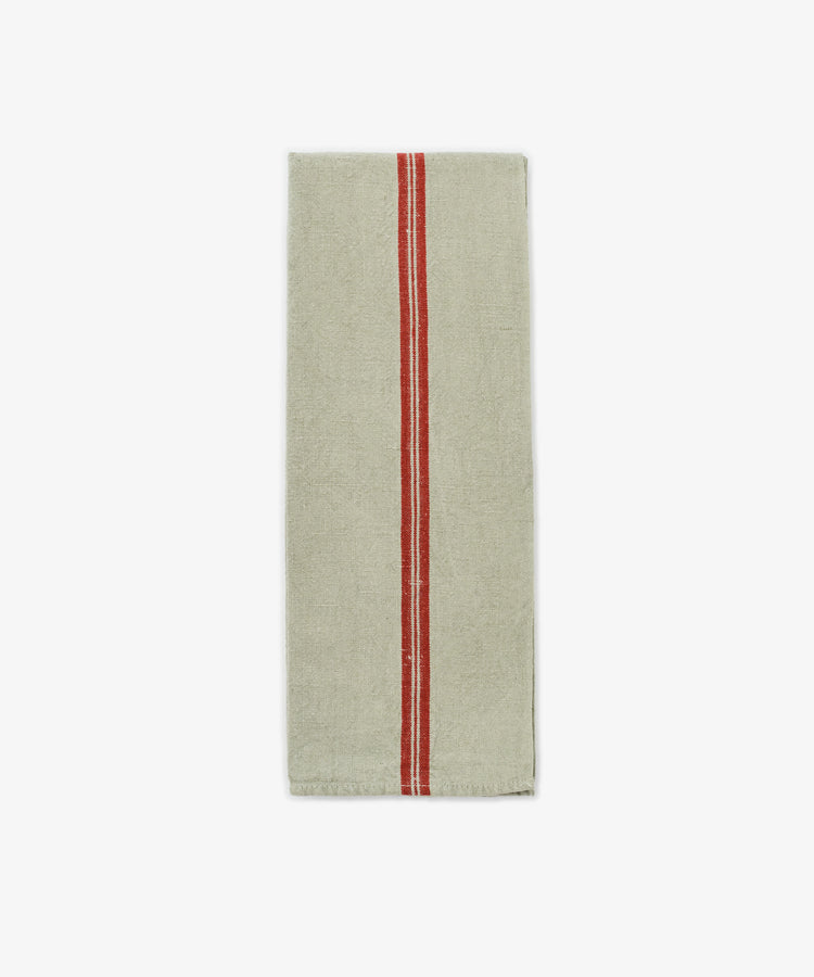 The French Vintage Tea Towel features a rectangular beige design with a single vertical red stripe down the center, evoking classic Provence style and vintage linen charm—an elegant addition to any kitchen décor. Displayed on a plain white background.