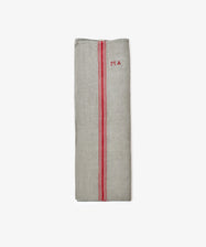 The French Vintage Tea Towel, a folded gray linen with red stripes and MA embroidery on the upper right, brings Provence charm to your kitchen.