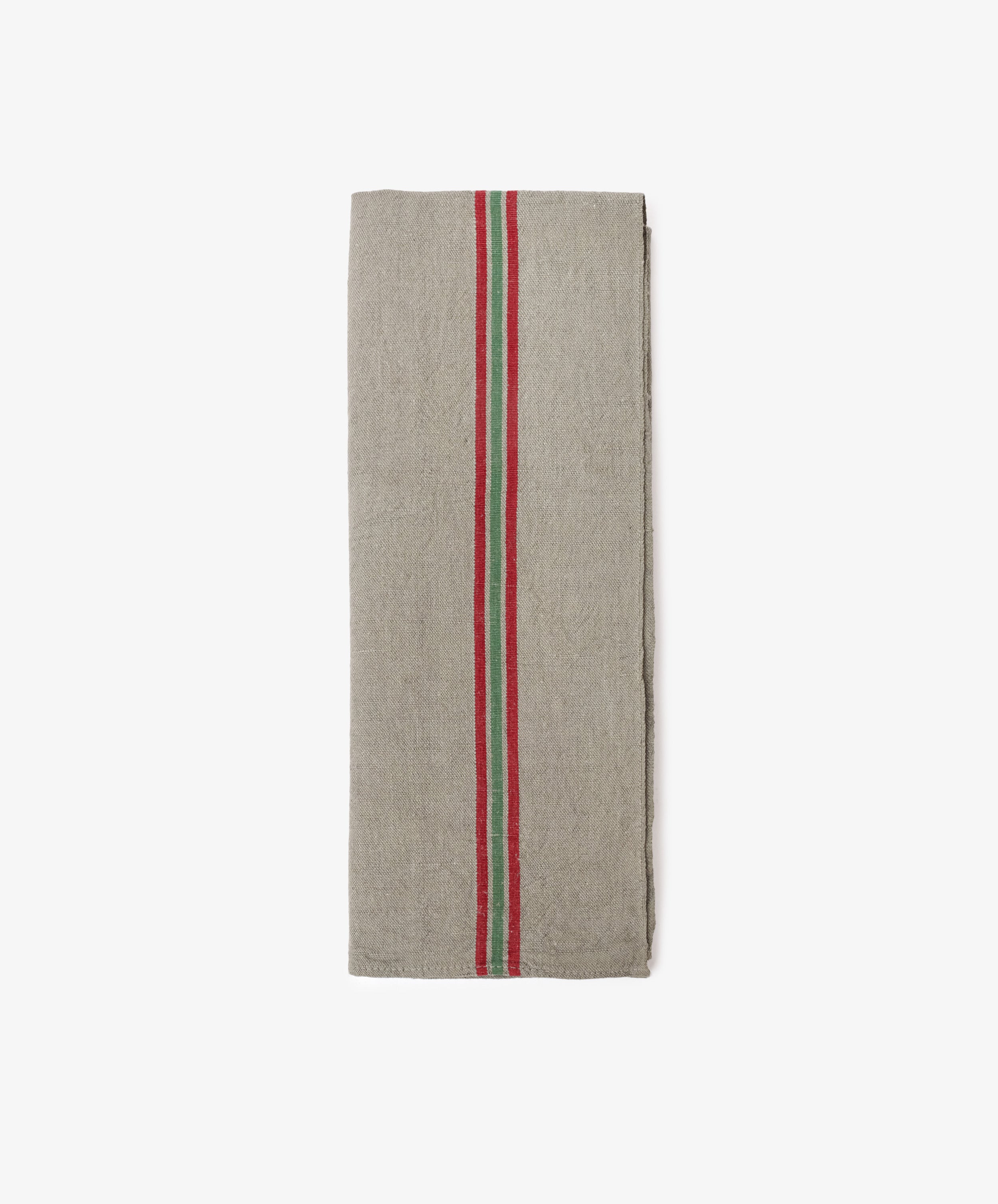 The French Vintage Tea Towel is a folded grey linen kitchen cloth with bold red and green center stripes, evoking classic Provence style, displayed on a plain white background.