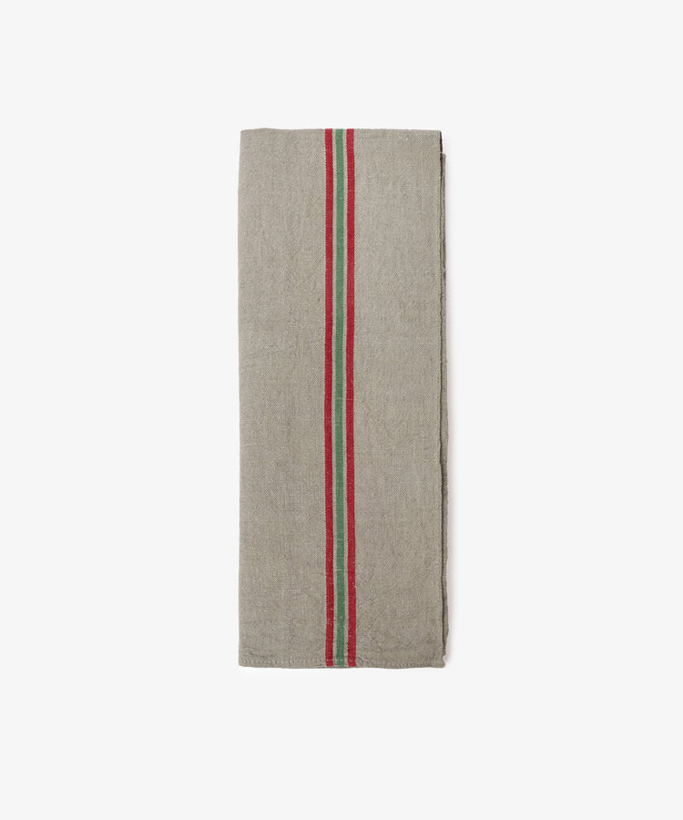 The French Vintage Tea Towel is a folded grey linen kitchen cloth with bold red and green center stripes, evoking classic Provence style, displayed on a plain white background.
